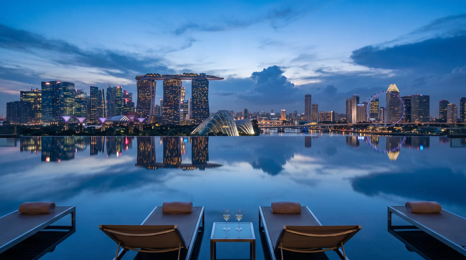 Rooftop infinity pool reflection at blue hour